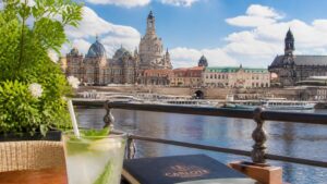 Dresden baroque Altstadt skyline and Elbe River cafe terrace with a paper straw