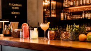 Stylish cocktail bar counter in Glockenbachviertel, Munich displaying paper straws